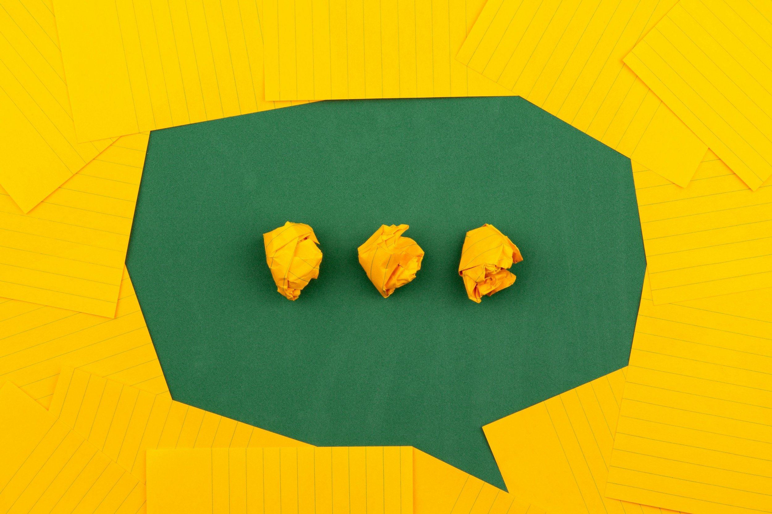 A message icon made of yellow paper